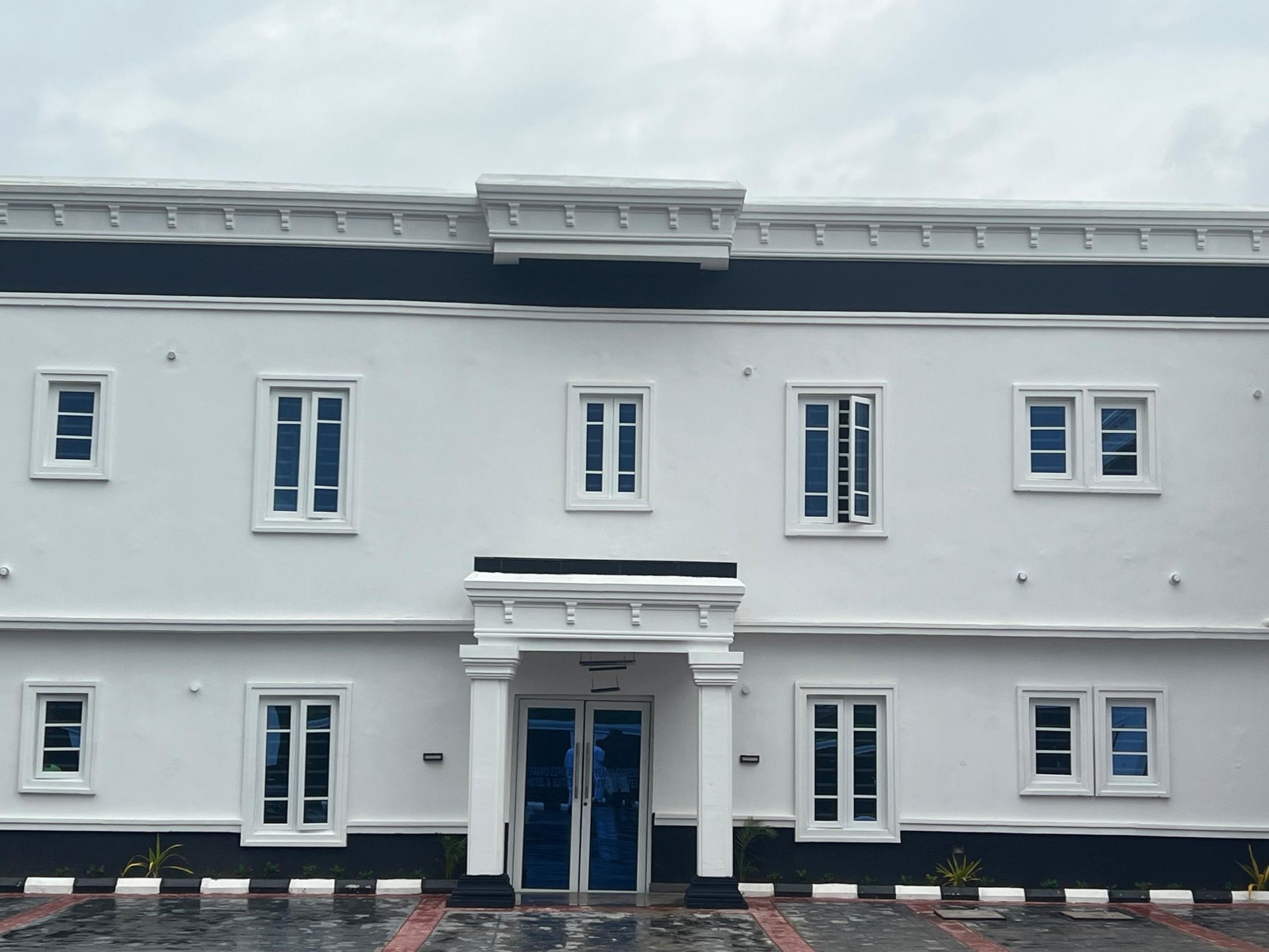 Front facade of Pyramid Express Hotel & Suite in daylight